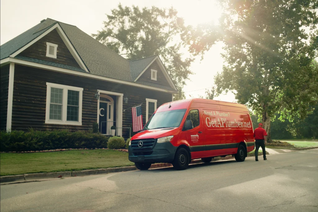 Plumbing technician arriving to customer's house